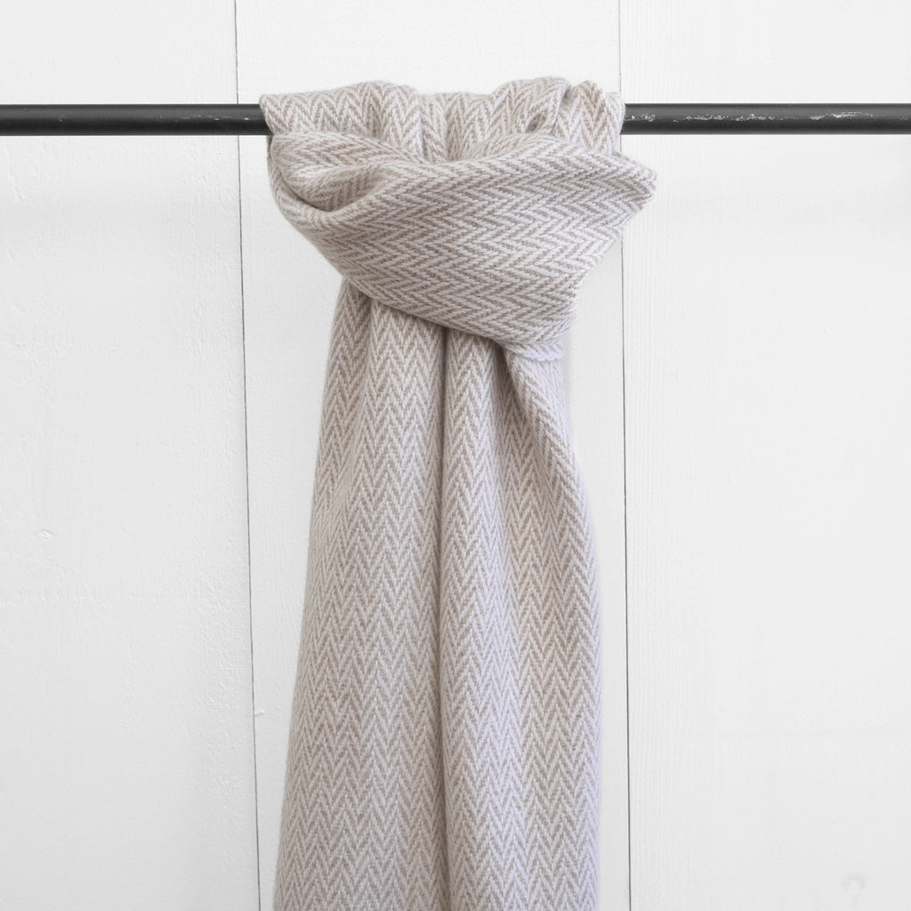 Nantucket Looms handwoven scarf in a rich latte shade, hanging gracefully, displaying the fine cashmere texture and craftsmanship.